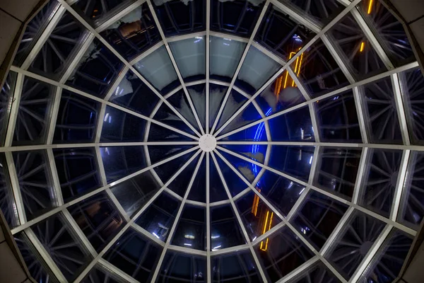 Glass transparent dome, bottom view at night