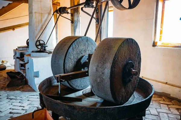 Old oil mill, millstones and and mechanical press