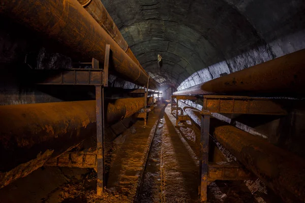 Rusty pipes of the pipeline of the heating main in round technic — Stock Photo, Image