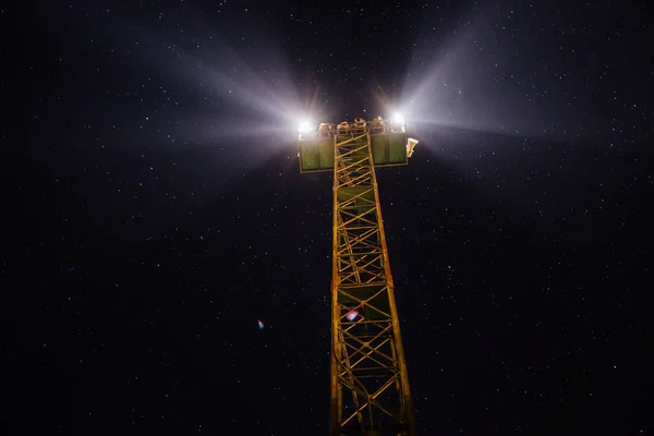 Light tower in starry night