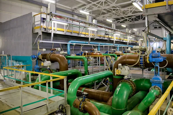 Pipes and sewage pumps inside modern industrial wastewater treat