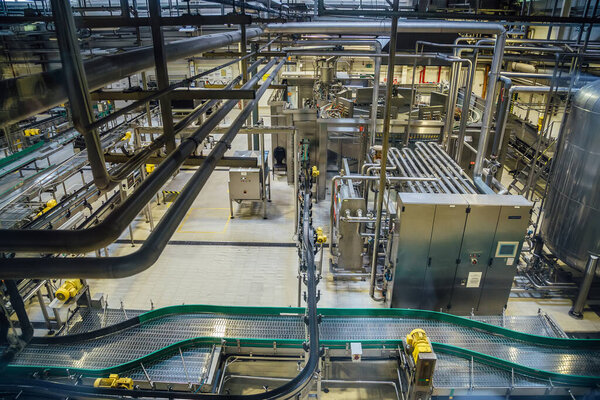 Modern brewery production line, aerial view. Conveyor belt, pipe