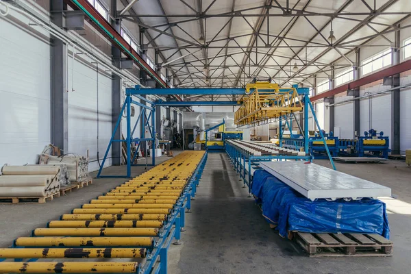 Modern thermal insulation sandwich panel production line. Machin