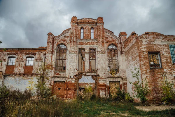 stock image Ruined facade of red brick industrial building in art nouveau st