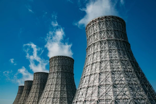 Cooling tower of nuclear power plant against blue sky