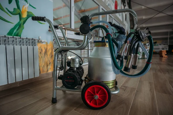 Small portable compact milking machine for milking one cow.