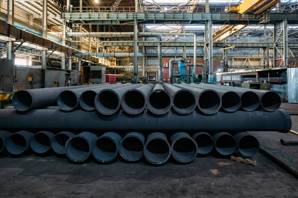 New cast iron pipes for pipeline construction in warehouse.