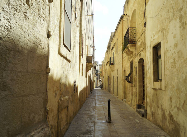 Empty narrow alley in Rabat, Malta