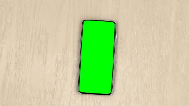 Smartphone Con Pantalla Verde Mesa Madera Vista Superior — Vídeo de stock