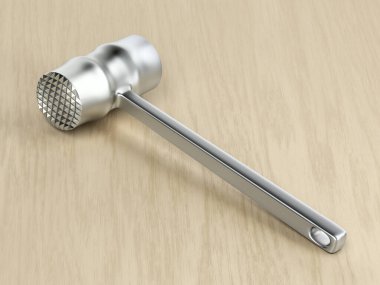 Tahta masada metal et çekici.