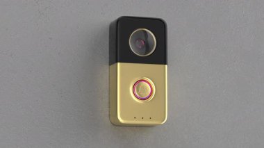 Koyu gri duvarda altın renkli video kapı zili