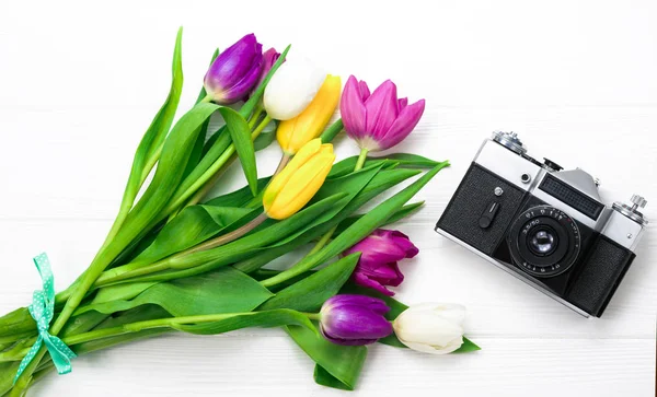 flowers and camera on a white background