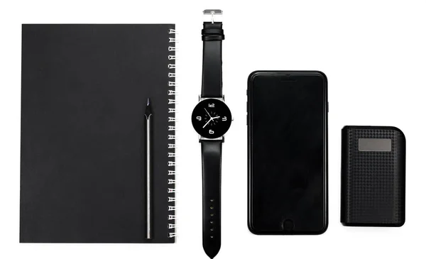 Black Clock Black Pencil Notebook Phone Power Station White Background — Stock Photo, Image