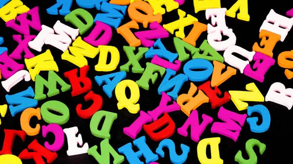 Scattered Color Letters Black Background — Stock Photo, Image
