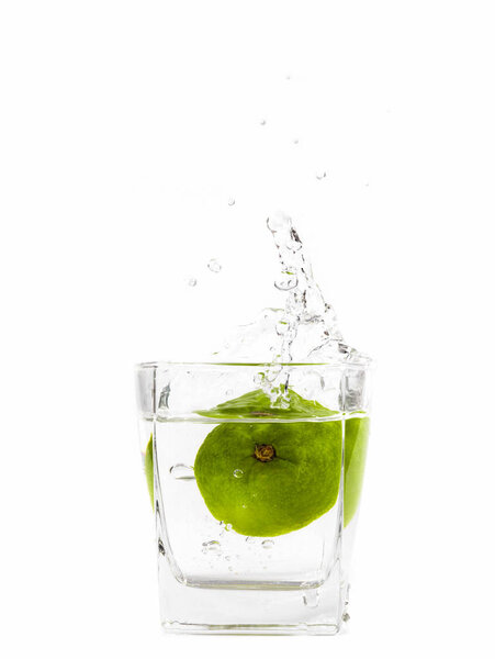 Lemon with a grass of water