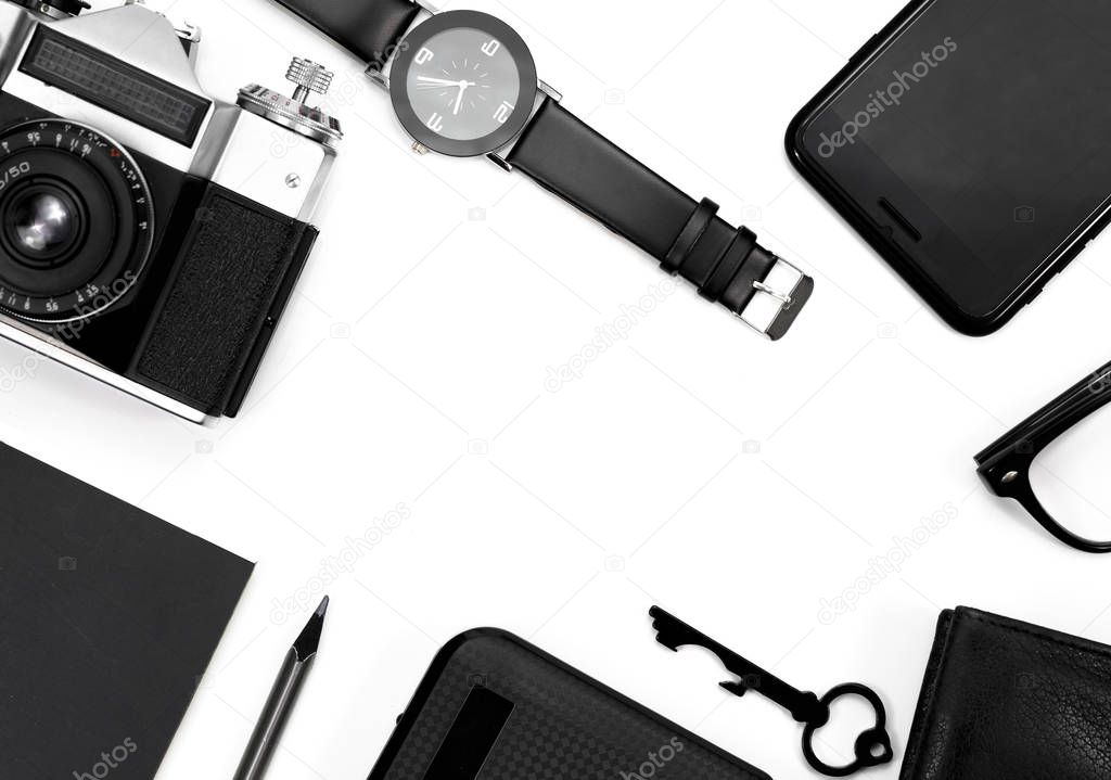 black clock, black pencil, black notepad, camera, black glasses, key, wallet on white background