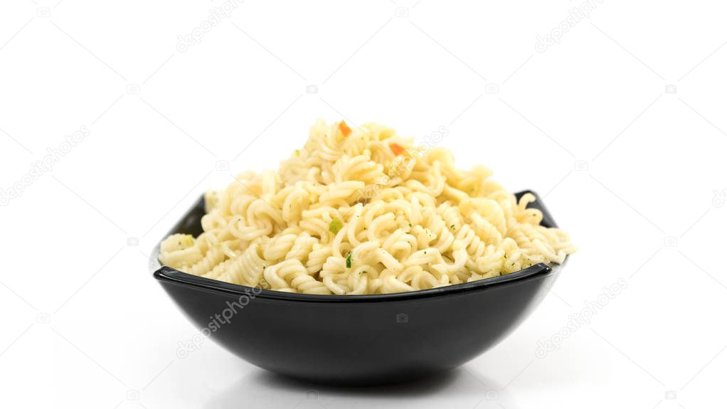 spaghetti in a black plate
