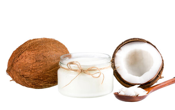 coconut, coconut oil and spoon with coconut flakes on a white background