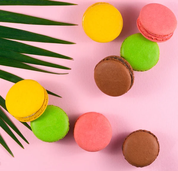 Close-Up Of Multi Colored Macaroons Over Pink Background
