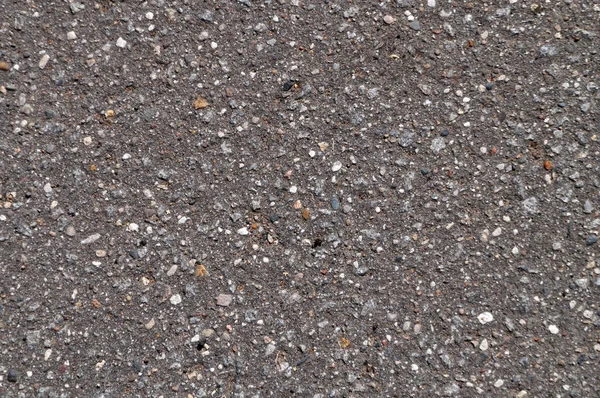 Macro de asfalto gris, parte de una carretera asfaltada — Foto de Stock