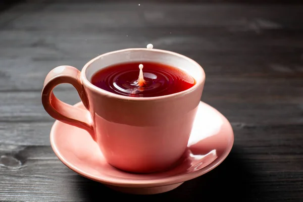 Tea and a drop of milk — Stock Photo, Image