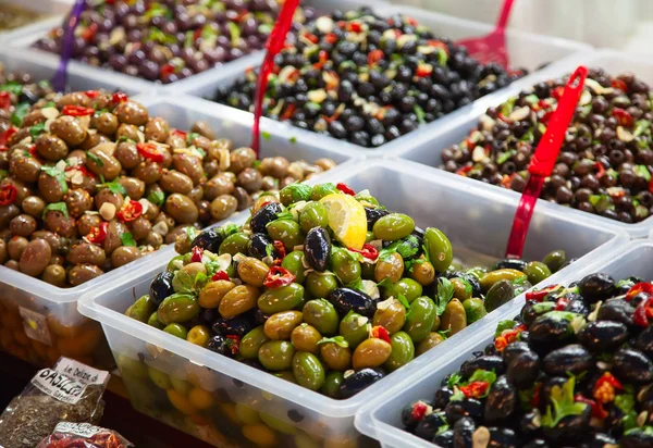 Marinated olives in boxes on local italian market