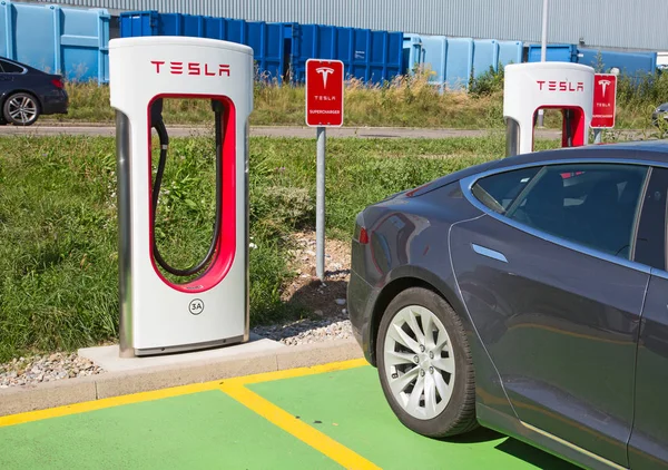 stock image ZURICH - September 8:  Tesla Supercharger station on September 8, 2018 in Zurich, Switzerland. Tesla motors develops network of the charging stations across Europe and World.