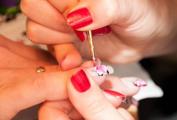 Manicure. Drawing a picture on a nail — Stock Photo, Image