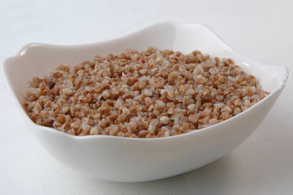 Groats porridge in plate on white — Stock Image Groats Porridge Plate White Stock Image