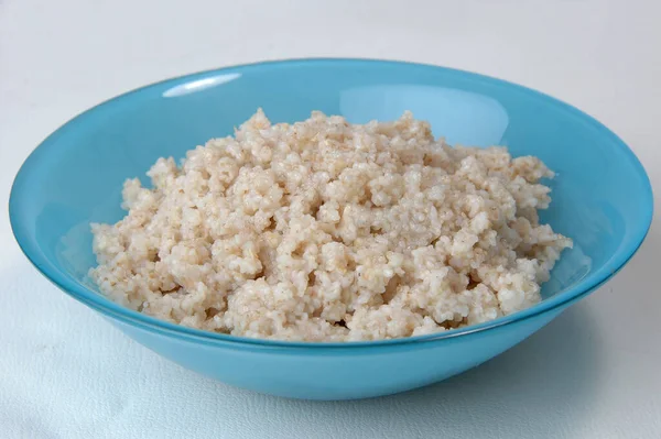 Groats porridge in plate on white — Stock Image Groats Porridge Plate White Royalty Free Stock Images
