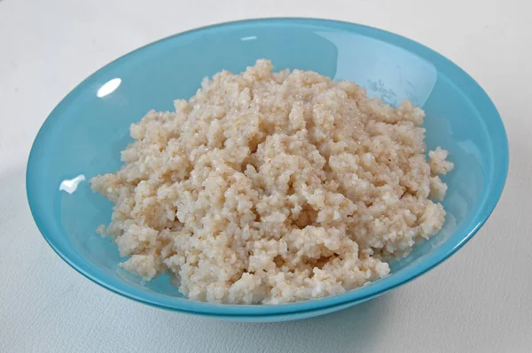 Groats porridge in plate on white — Stock Image Groats Porridge Plate White Royalty Free Stock Photos