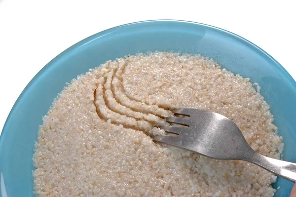 Groats porridge in plate on white — Stock Image Groats Porridge Plate White Royalty Free Stock Photos