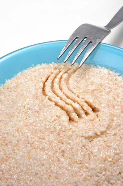 Groats porridge in plate on white — Stock Image Groats Porridge Plate White Stock Photo