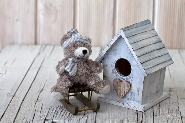 Teddy bear and little house — Stock Photo, Image