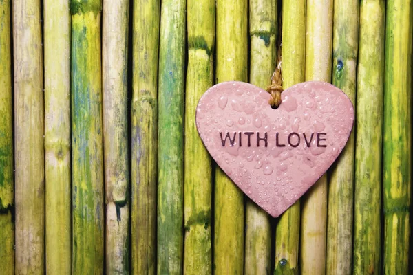 Pink Heart With Love Text On Bamboo — Stock Photo, Image