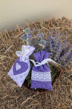 Pretty hand-sewn fabric bags with lavender flowers clipart