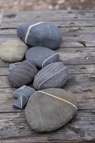 Pebble Collection On Old Pier — Stock Photo, Image