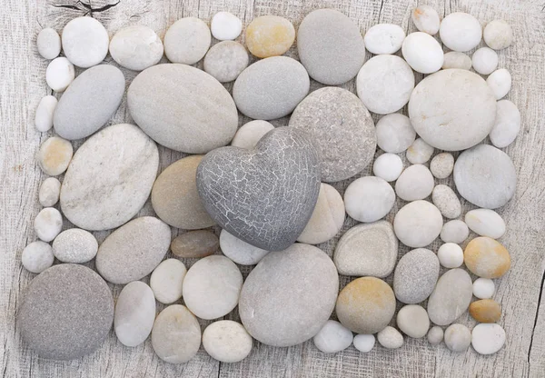 Simple Grey Heart On Pebble Background — Stock Photo, Image