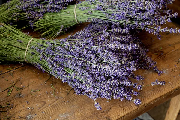 Lavender Flower Bundles On Old Wooden Table