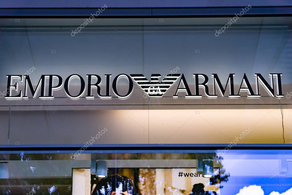 Wiesbaden, Germany - June 03 2018: EMPORIO ARMANI logo on a facade. Armani is an international fashion house, founded in 1975 by Giorgio Armani.