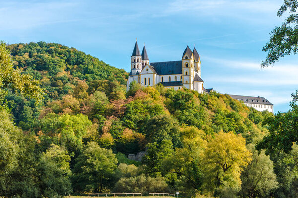 Monastery Arnstein with river Lahn in the Foreground on a beautiful day in autuum