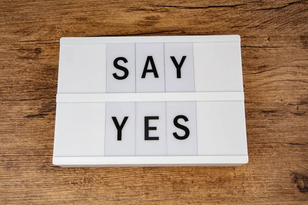 Say Yes Letters Light Box Wooden Background — стоковое фото