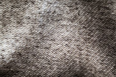 Seçici odaklı koyu dokuma dokusuna yakın çekim