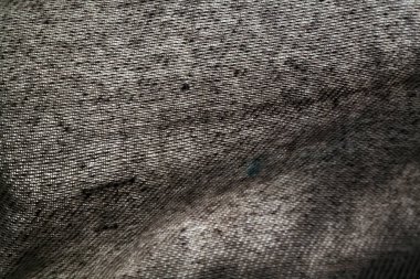 Seçici odaklı koyu renkli arka plan yünlü dokuya yakın çekim