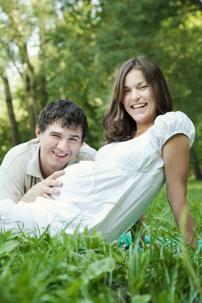 Pregnant Wife Her Husband Touching Her Belly Green Grass — Stock Photo, Image