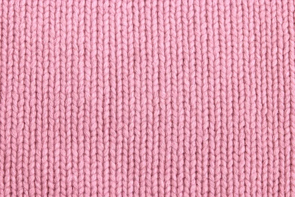 シームレスなピンクのニット生地の質感のクローズアップ — ストック写真
