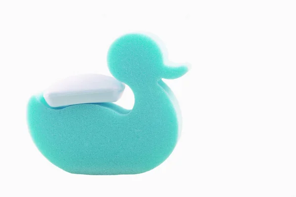 Cyan Duck Sponge Carrying Piece Soap Its Back White Background — Stock Photo, Image