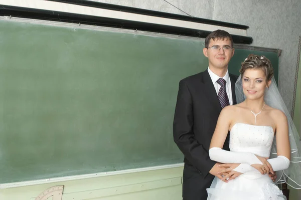 Smiling Bride Groom Standing Next Blank Blackboard Classroom — Stock Photo, Image