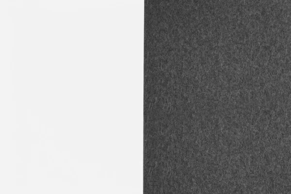Zwart Papier Textuur Naast Wit Vel — Stockfoto