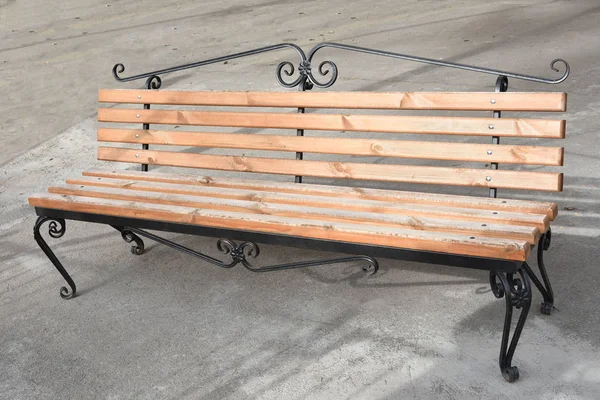 A modern bench in the park. — Stock Photo, Image